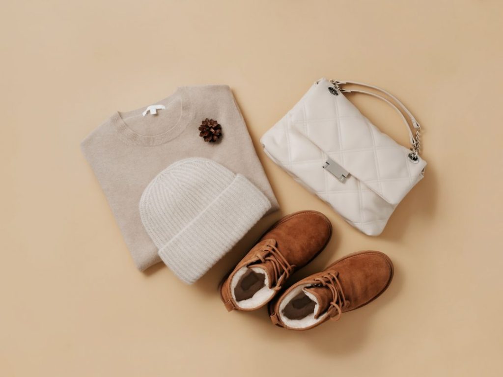 winter cozy fashion flat lay sweater hat boots bag.jpg